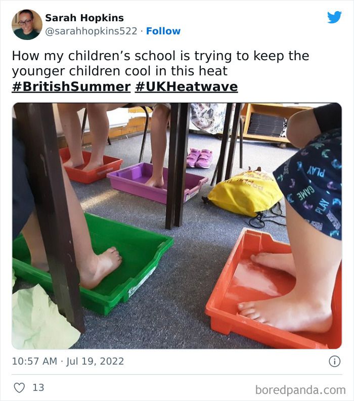 children are putting their feet in water buckets to stay cool