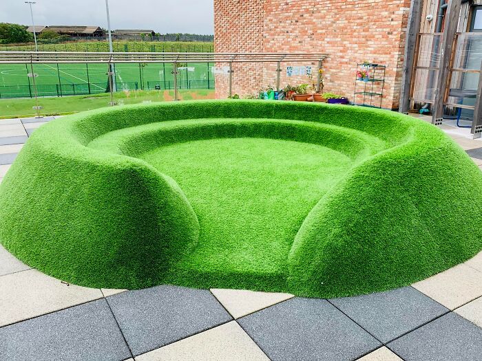 Artificial Grass Seating Looks Like It Was Rendered In Badly To The Scenery
