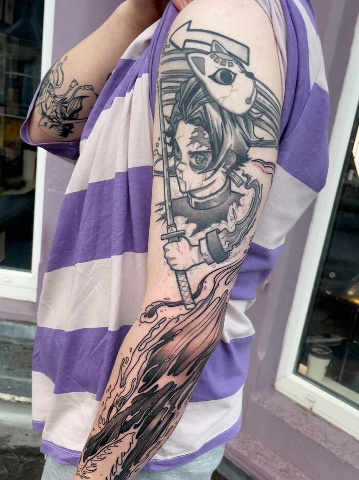 hinokami kagura, a continuation of demon slayer, anime sleeve tattoo