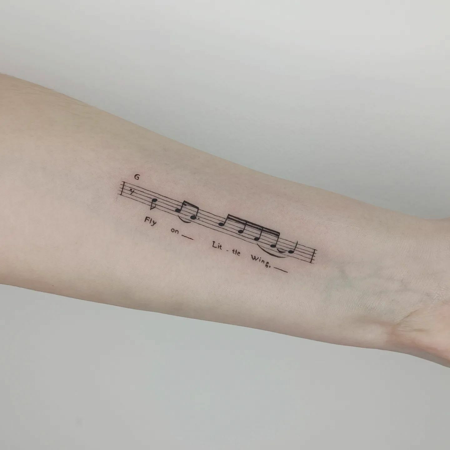 Tatouage simple de notes de musique